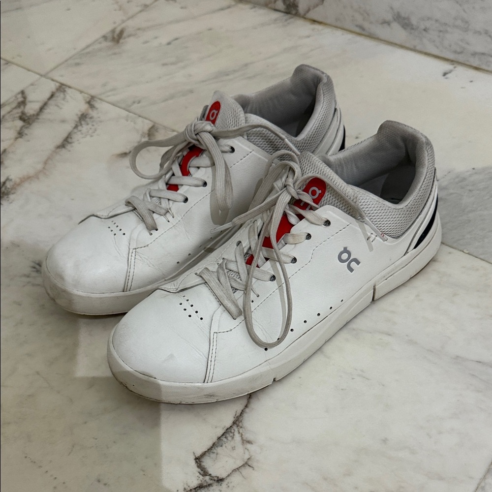 On Running White and Red Sneakers